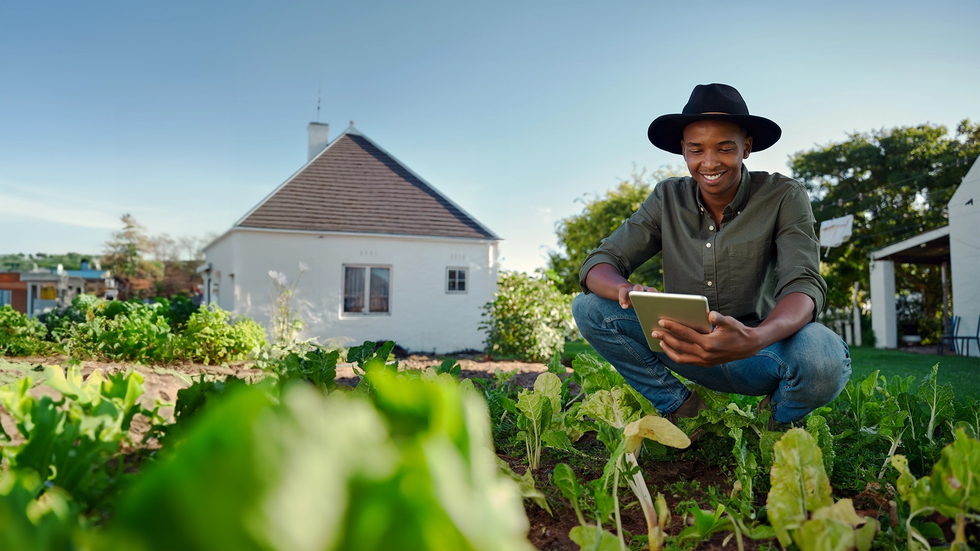 Farmer with tablet in field